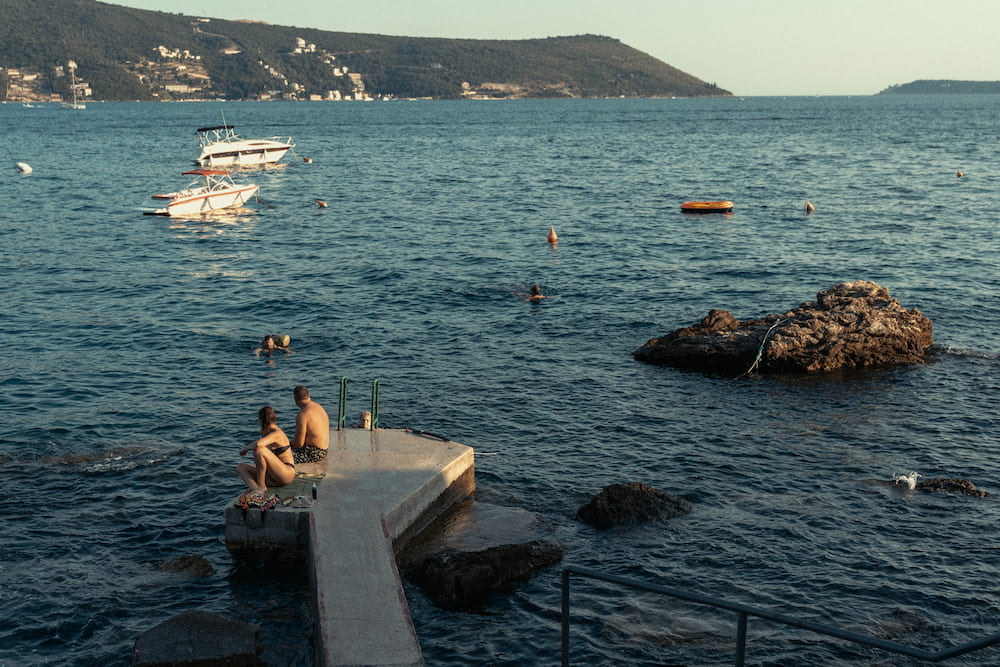 The pier and boats, hills across the bay