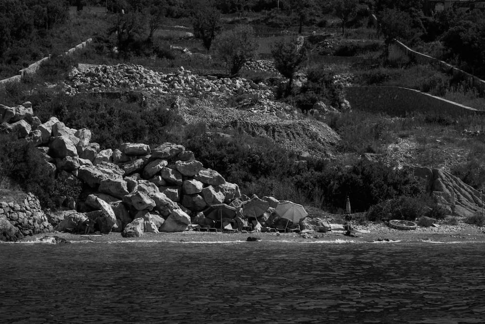 Black and white: rocks piled on a shore