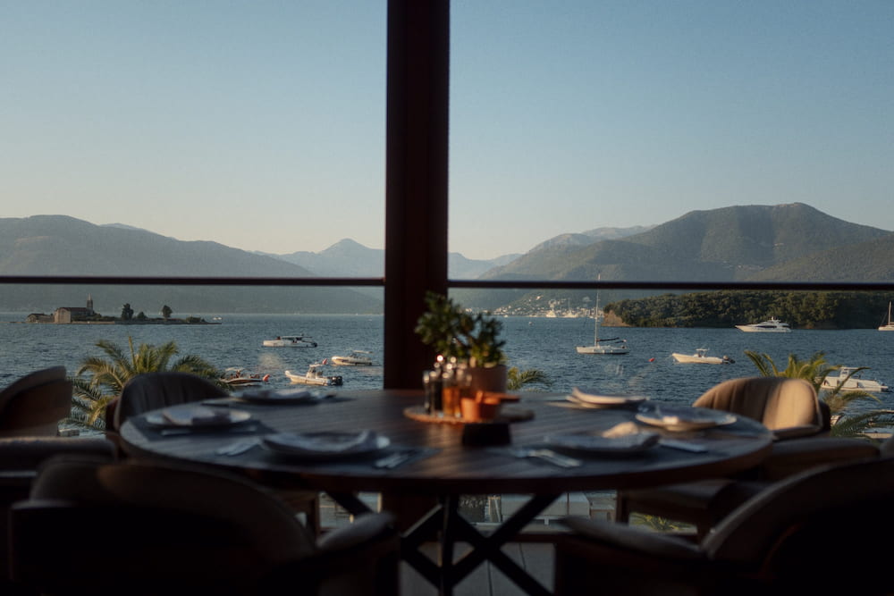 A restaurant table on a terrace over the bay